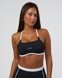 Woman wearing Liberate Sports Bra - Black-White | Model:Bianca | Size:S | Thumbnail Index: 0