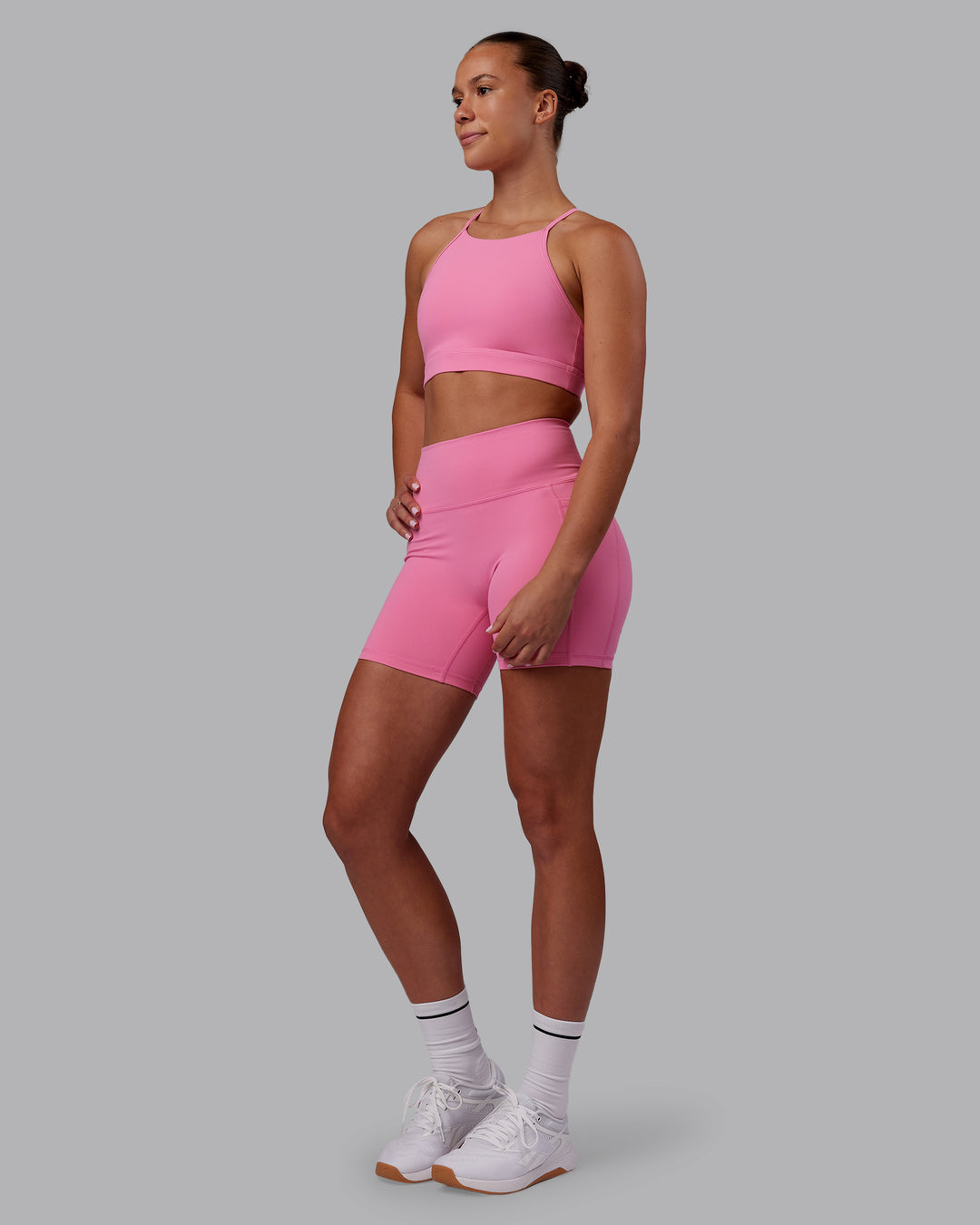 Woman wearing Lift High Neck Sports Bra - Candy Pink | Model:Charlize | Size:S - view 3