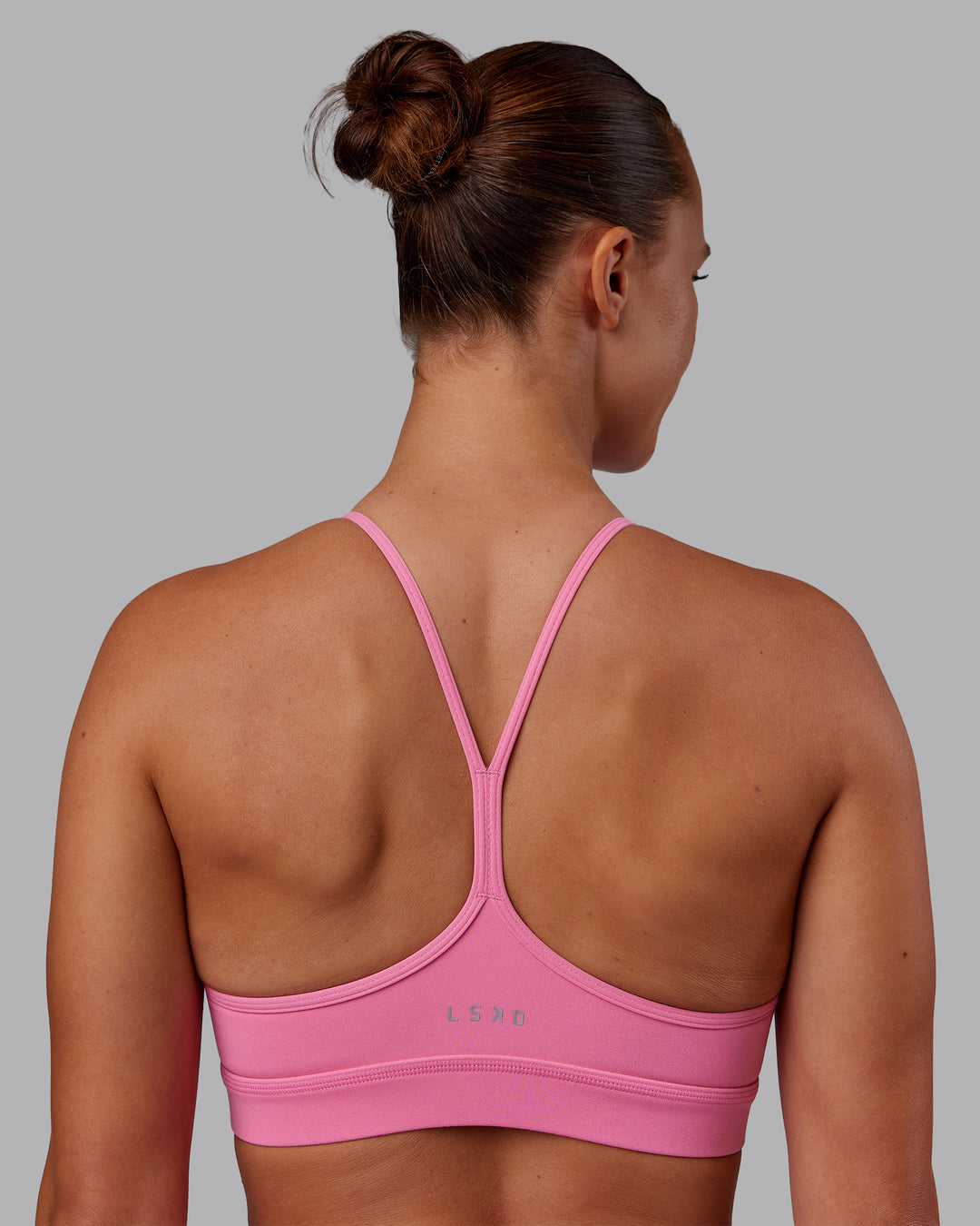 Woman wearing Lift High Neck Sports Bra - Candy Pink | Model:Charlize | Size:S - view 2