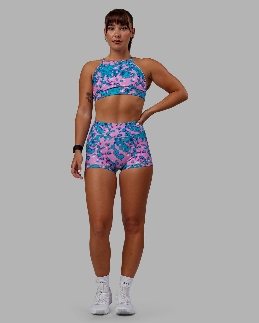 Woman wearing Lift High Neck Sports Bra - Neon Camo - view 6