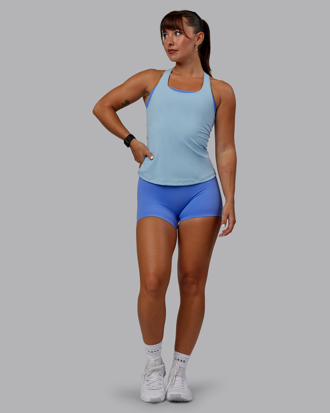 Woman wearing Lift Performance Tank - Glacial Blue - view 7