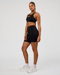 Woman wearing LimitLift Sports Bra - Black | Model:Rosie | Size:S | Thumbnail Index: 4