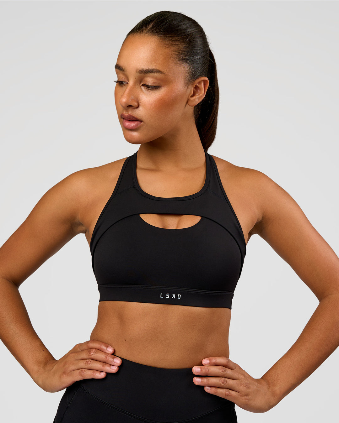 Woman wearing LimitLift Sports Bra - Black | Model:Rosie | Size:S - view 3