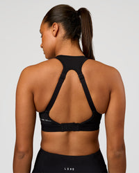 Woman wearing LimitLift Sports Bra - Black | Model:Rosie | Size:S | Thumbnail Index: 1