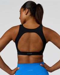 Model wearing Limitless Sports Bra - Black | Model:Rosie | Size:S | Thumbnail Index: 1