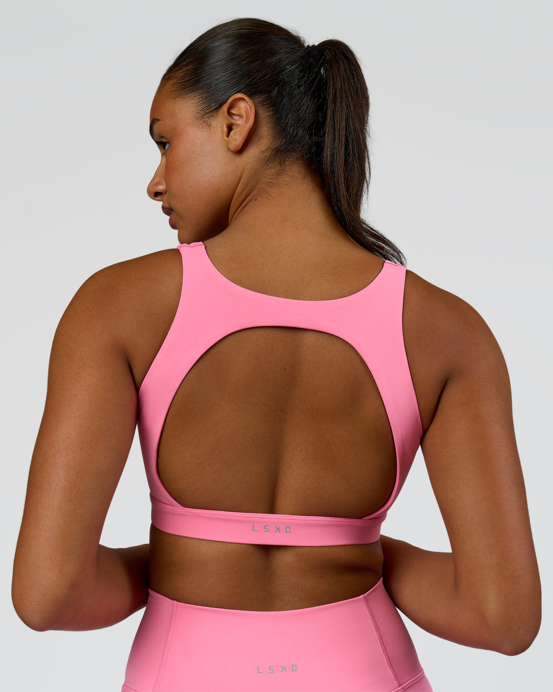 Model wearing Limitless Sports Bra - Candy Pink | Model:Rosie | Size:S - view 1