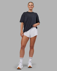 Woman wearing Love The Run FLXCotton Tee Oversize - Black Washed-Circular Grey | Model:Neve | Size:S | Thumbnail Index: 4