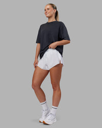 Woman wearing Love The Run FLXCotton Tee Oversize - Black Washed-Circular Grey | Model:Neve | Size:S | Thumbnail Index: 7