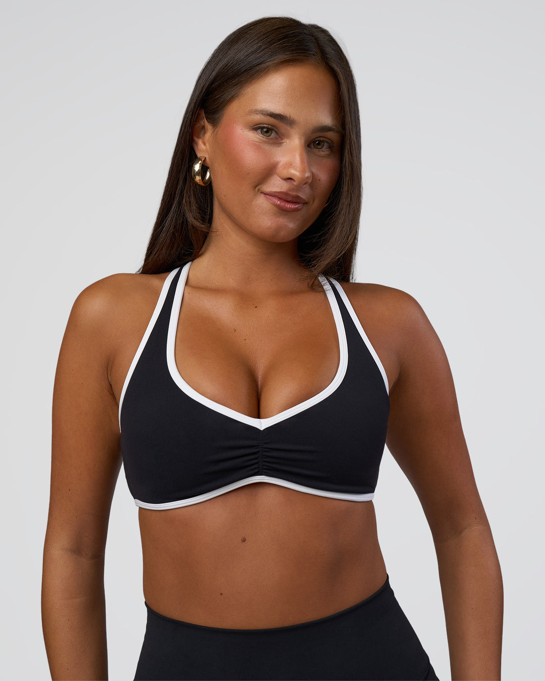 Woman wearing Luminous Sports Bra - Black-White | Model:Bianca | Size:S - view 1