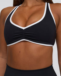 Woman wearing Luminous Sports Bra - Black-White | Model:Bianca | Size:S | Thumbnail Index: 4