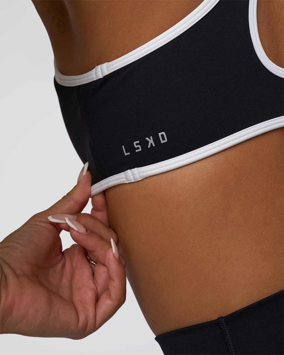 Woman wearing Luminous Sports Bra - Black-White | Model:Bianca | Size:S - view 4