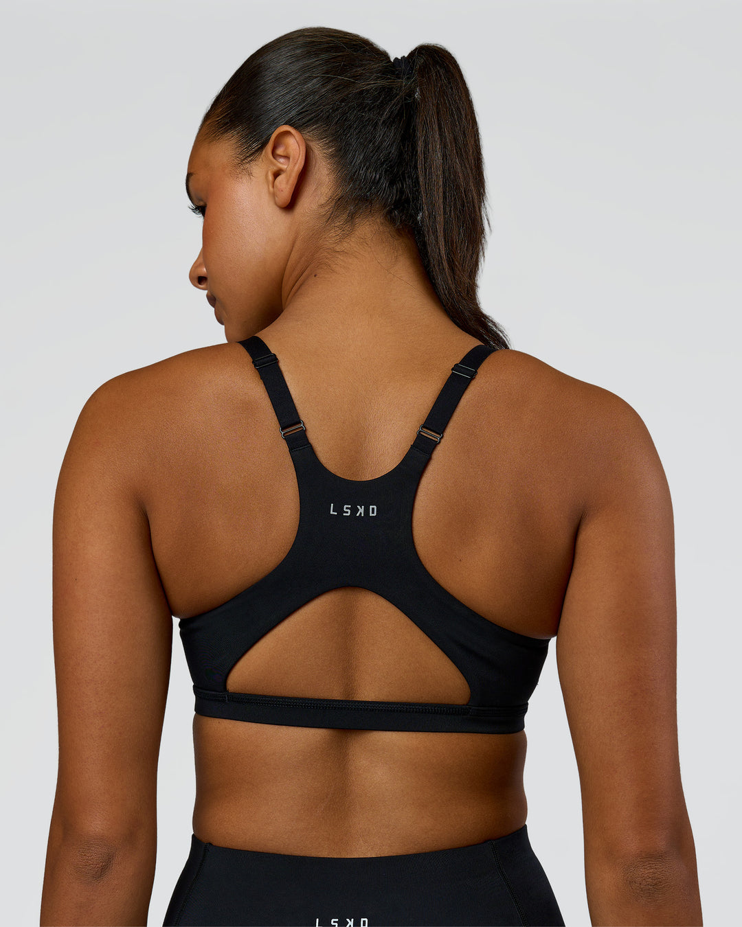 Woman wearing Luna Sports Bra - Black | Model:Rosie | Size:S - view 6