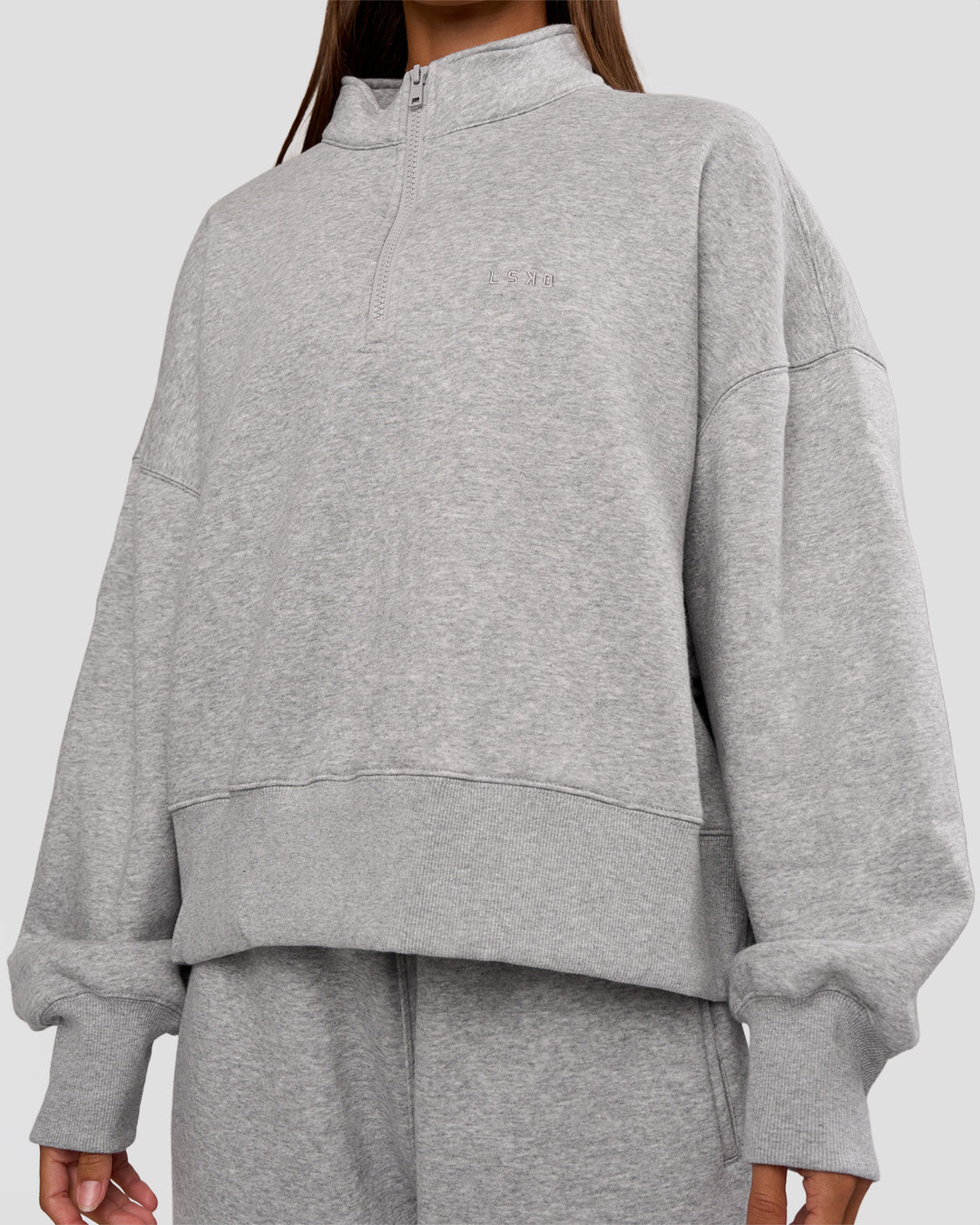 Woman wearing MVP 1/2 Zip Oversized Sweater - Light Grey Marl | Model:Brylee | Size:S - view 6
