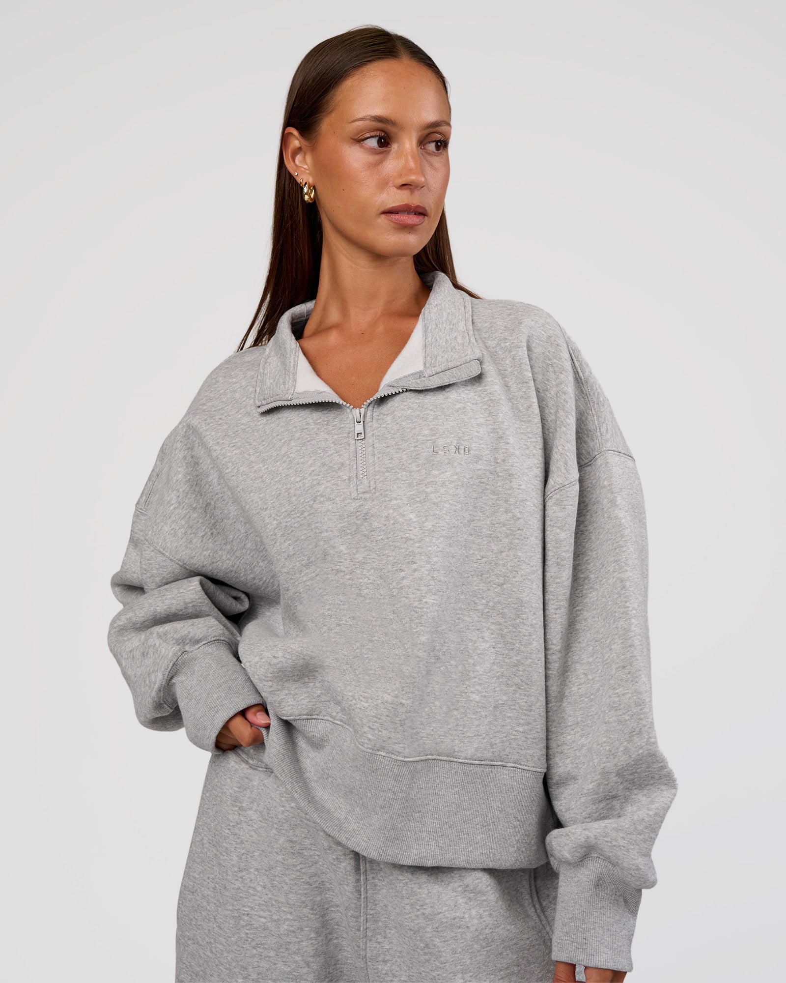 Woman wearing MVP 1/2 Zip Oversized Sweater - Light Grey Marl | Model:Brylee | Size:S