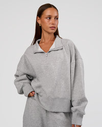 Woman wearing MVP 1/2 Zip Oversized Sweater - Light Grey Marl | Model:Brylee | Size:S | Thumbnail Index: 0