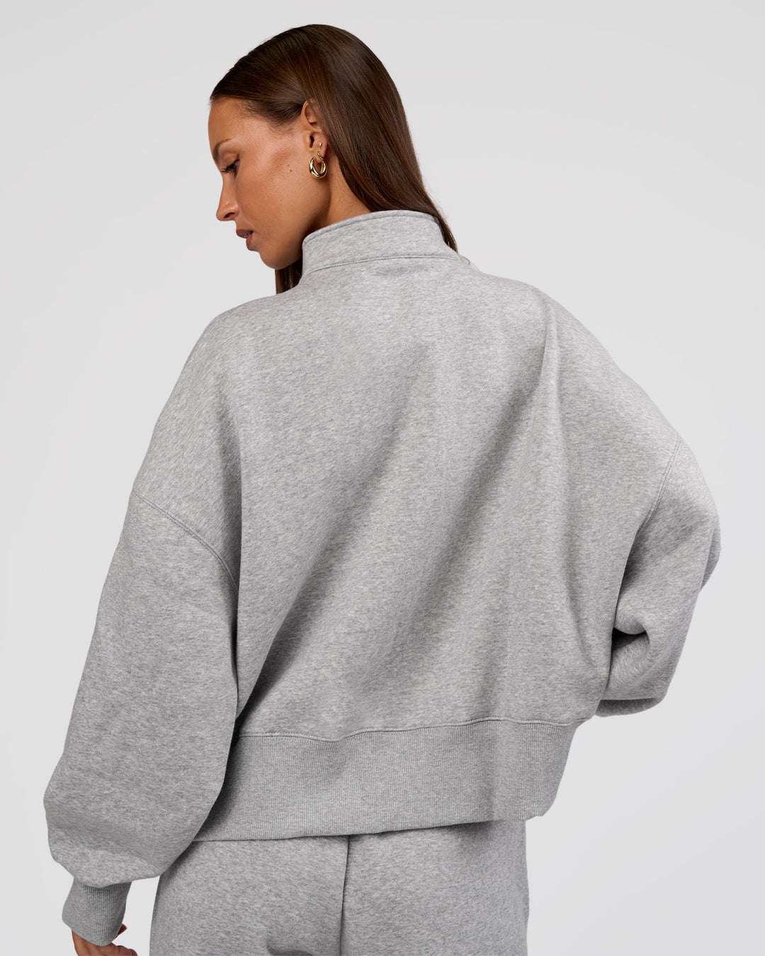 Woman wearing MVP 1/2 Zip Oversized Sweater - Light Grey Marl | Model:Brylee | Size:S - view 4