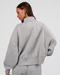 Woman wearing MVP 1/2 Zip Oversized Sweater - Light Grey Marl | Model:Brylee | Size:S | Thumbnail Index: 3
