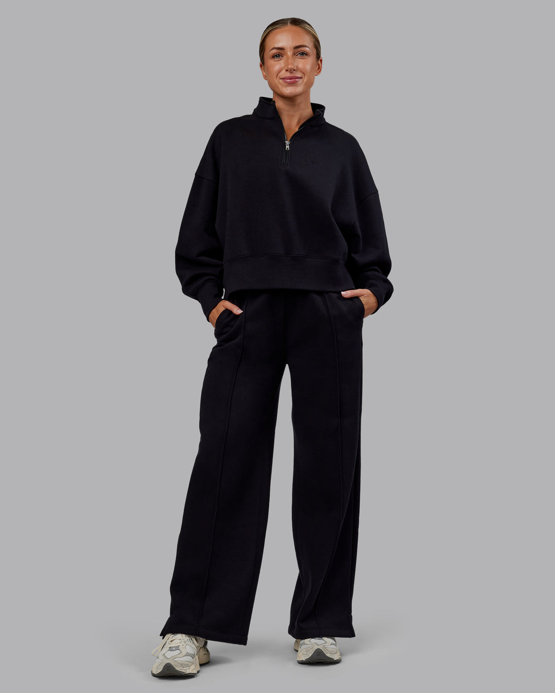 Woman wearing MVP 1/2 Zip Oversized Sweater - Black | Model:Paris | Size:S - view 2