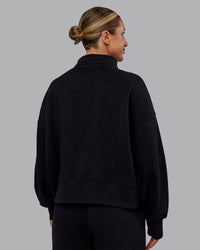 Woman wearing MVP 1/2 Zip Oversized Sweater - Black | Model:Paris | Size:S | Thumbnail Index: 2