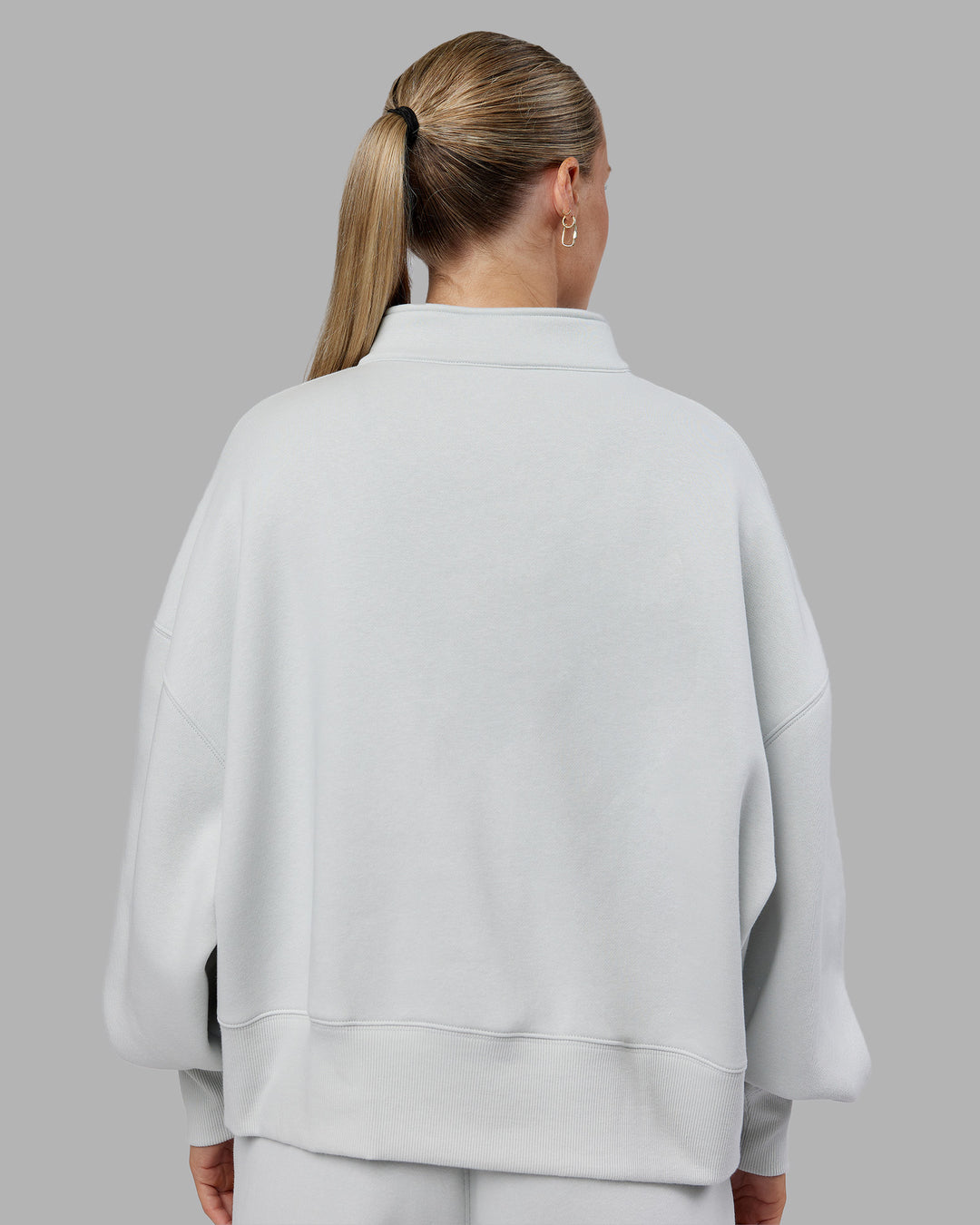 Woman wearing MVP 1/2 Zip Oversized Sweater - Digital Mist | Model:Neve | Size:S - view 4