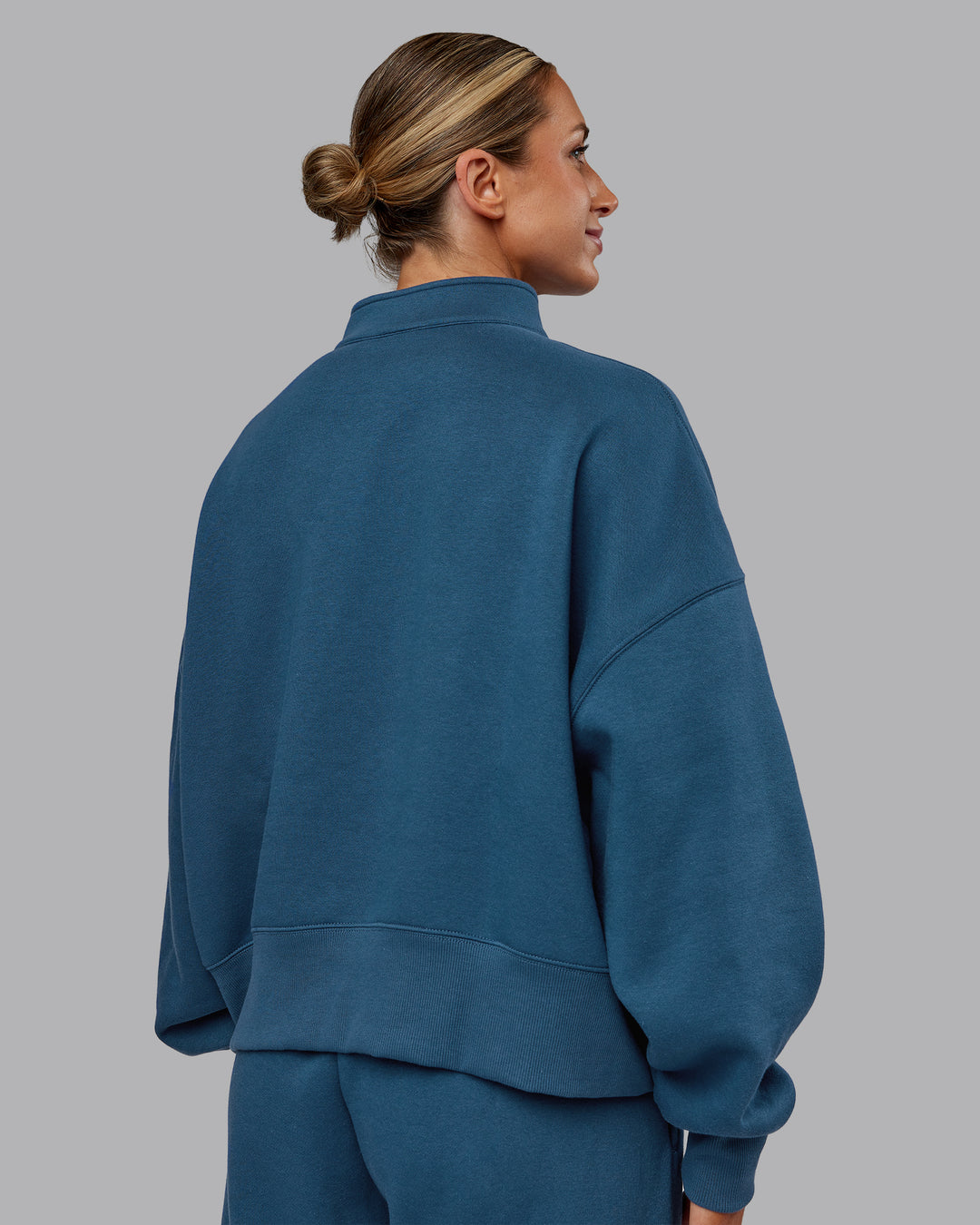 Woman wearing MVP 1/2 Zip Oversized Sweater - Indigo | Model:Paris | Size:S - view 4