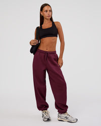 Woman wearing MVP Oversized Slouchy Fit Track Pant - Cherry Lacquer | Model:Brylee | Size:S | Thumbnail Index: 1
