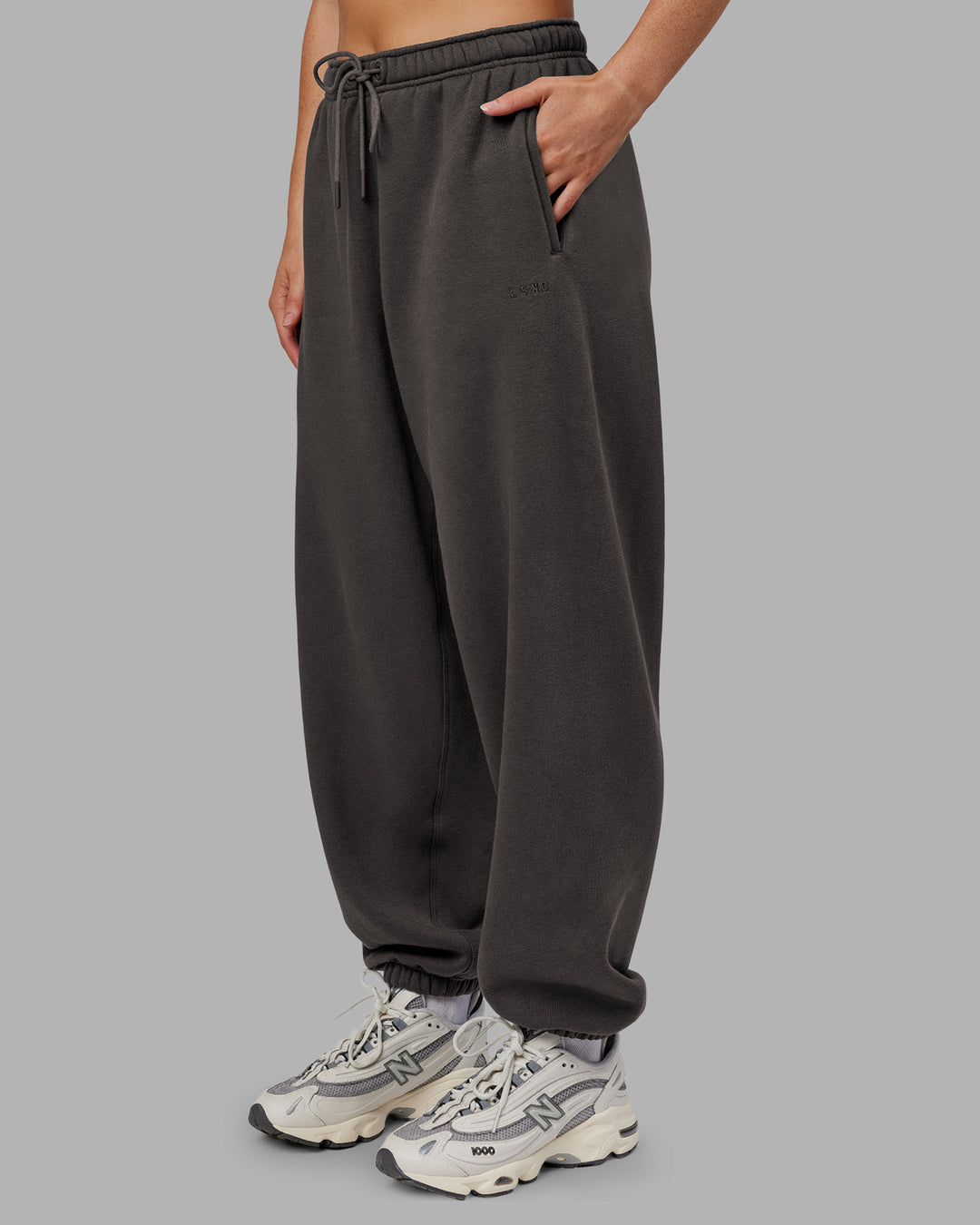 Woman wearing MVP Oversized Slouchy Fit Track Pant - Dark Storm | Model:Neve | Size:S - view 1