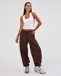 Woman wearing MVP Oversized Slouchy Fit Track Pant - Hot Chocolate | Model:Brylee | Size:S | Thumbnail Index: 1