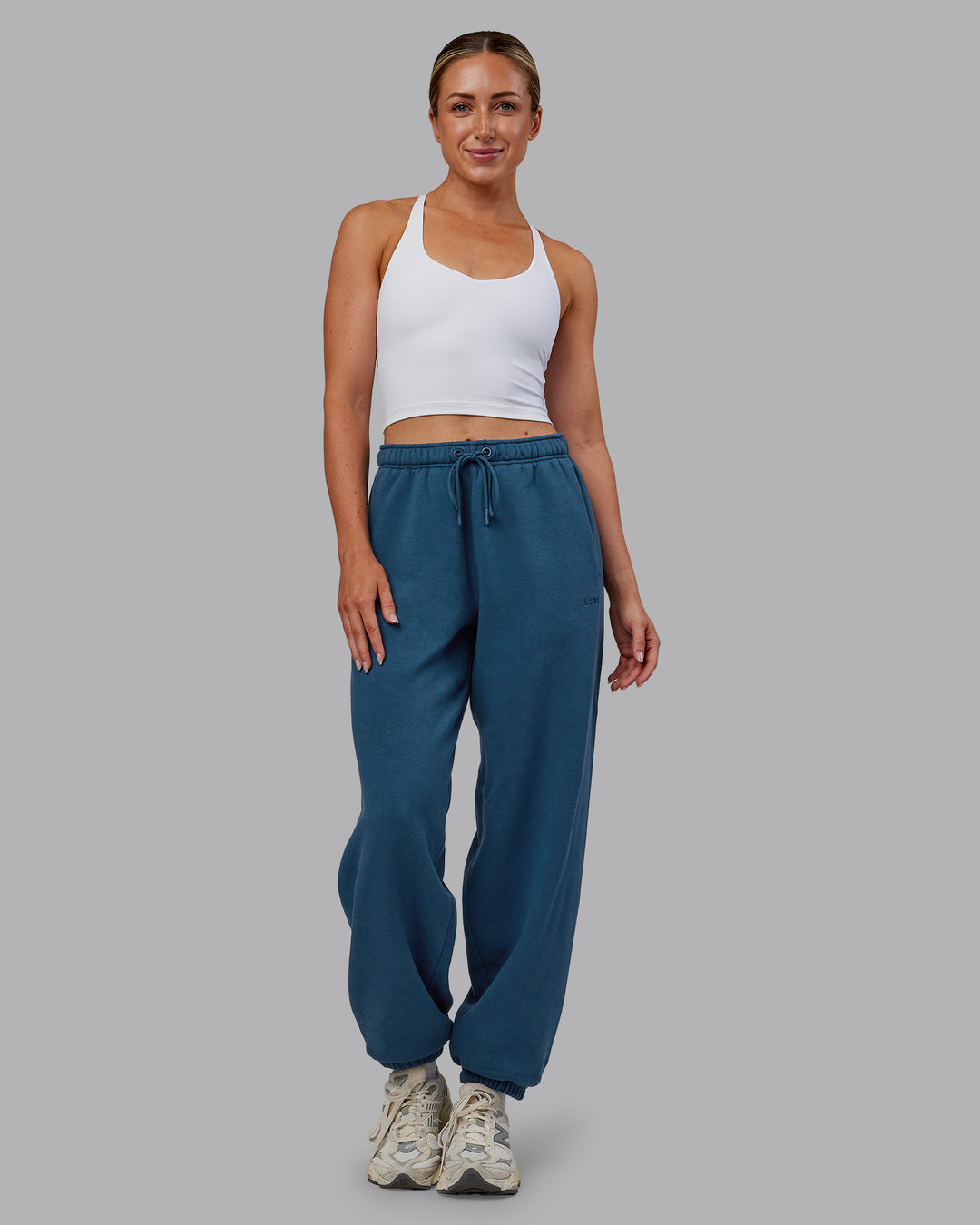 Woman wearing MVP Oversized Slouchy Fit Track Pant - Indigo | Model:Paris | Size:S - view 5