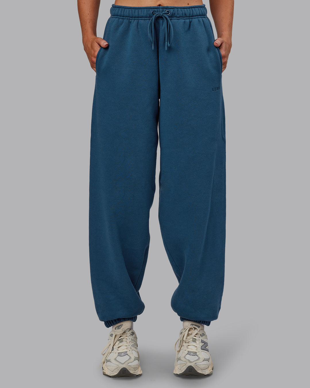 Woman wearing MVP Oversized Slouchy Fit Track Pant - Indigo | Model:Paris | Size:S - view 1