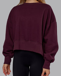 Woman wearing MVP Oversized Sweater - Cherry Lacquer | Model:Emilie | Size:S | Thumbnail Index: 4