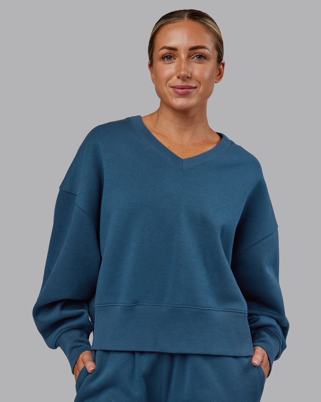 Woman wearing MVP V Neck Oversized Sweater - Indigo | Model:Paris | Size:S - view 1