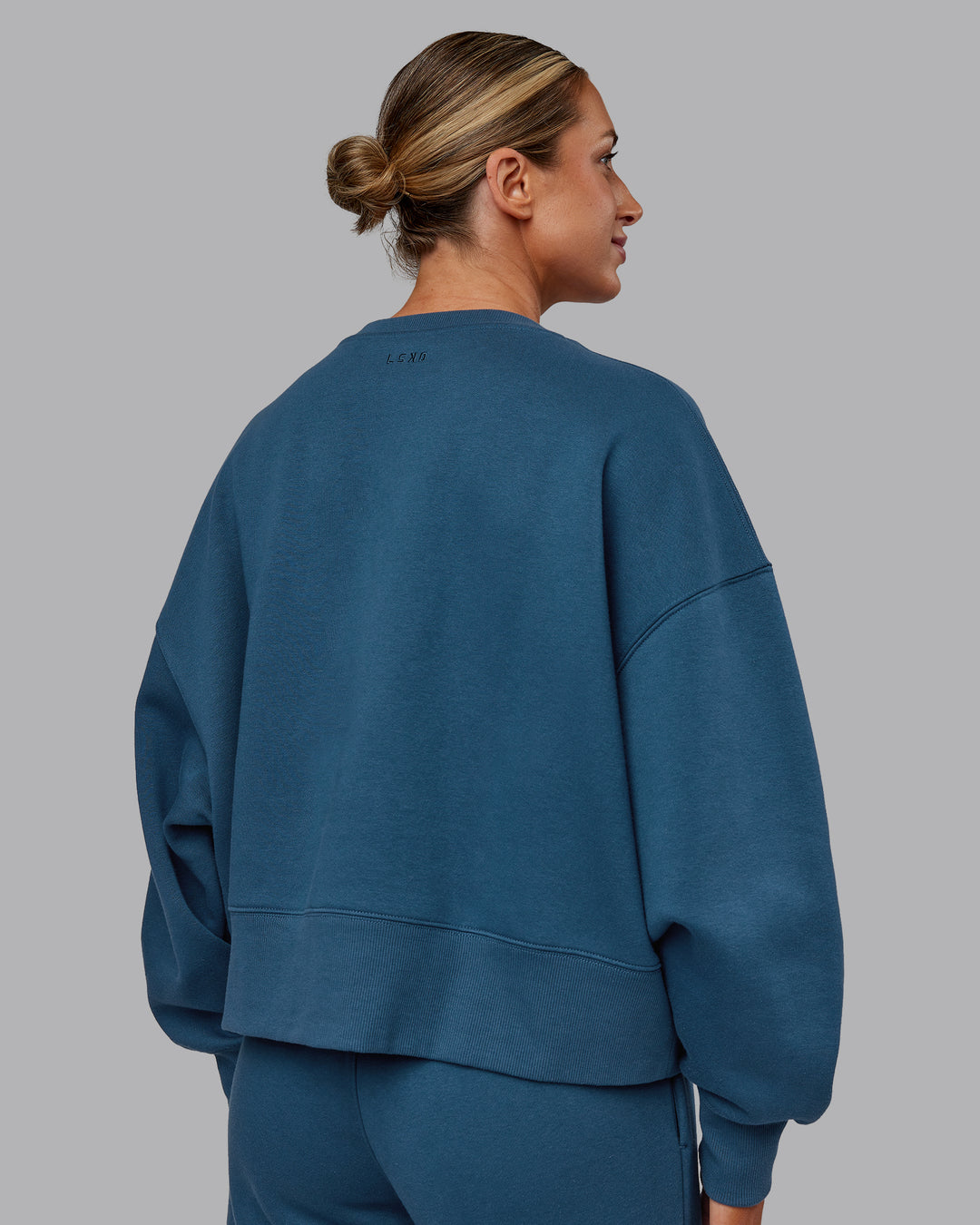 Woman wearing MVP V Neck Oversized Sweater - Indigo | Model:Paris | Size:S - view 4