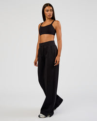 Woman wearing MVP Wide Leg Tall Track Pant - Black | Model:Ruby | Size:S | Thumbnail Index: 1