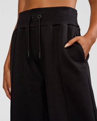Woman wearing MVP Wide Leg Tall Track Pant - Black | Model:Ruby | Size:S | Thumbnail Index: 2