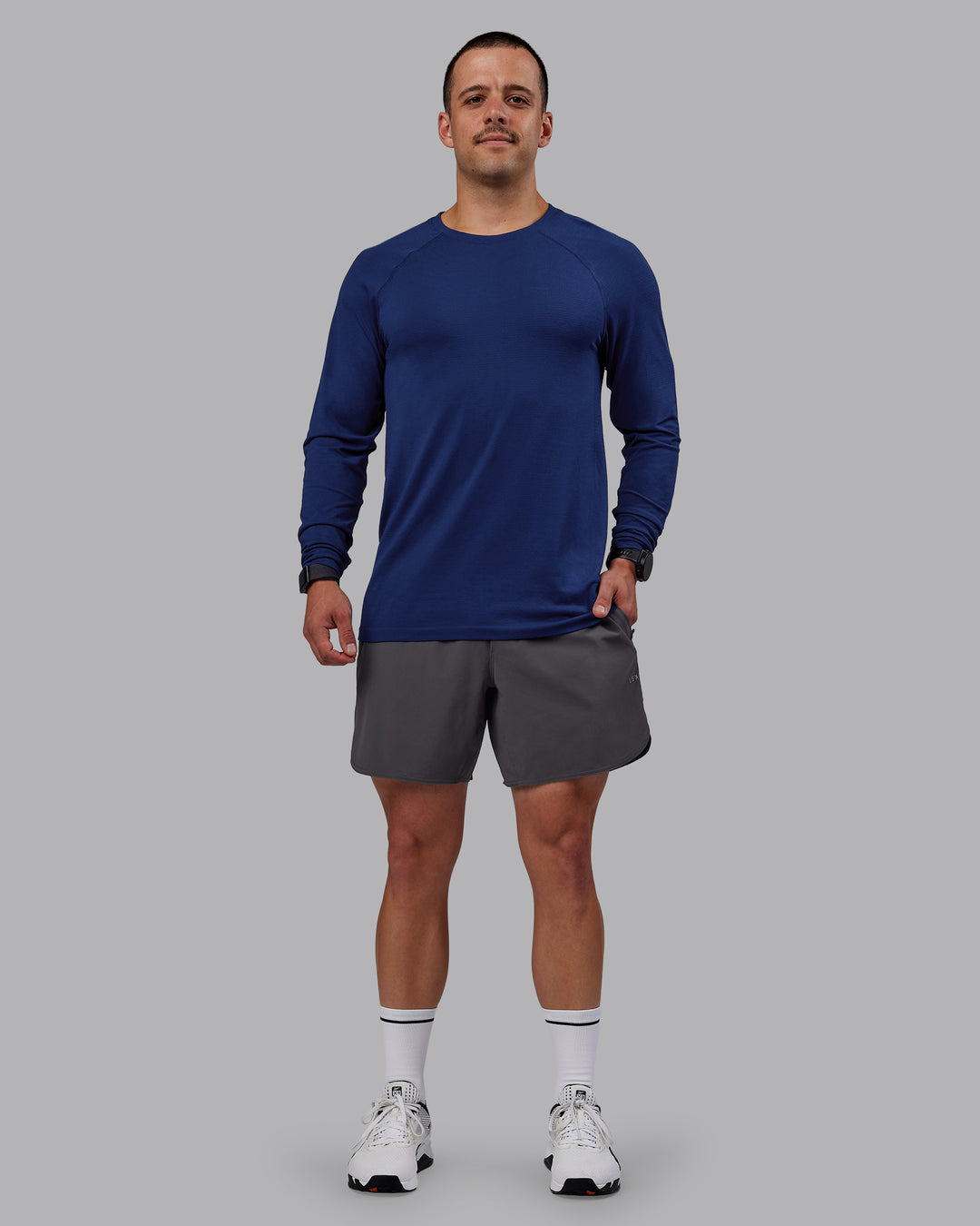 Man wearing AeroFLX+ Seamless Long Sleeve Tee - Midnight Blue/Midnight Blue Marl - view 5
