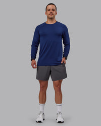 Man wearing AeroFLX+ Seamless Long Sleeve Tee - Midnight Blue/Midnight Blue Marl | Thumbnail Index: 4