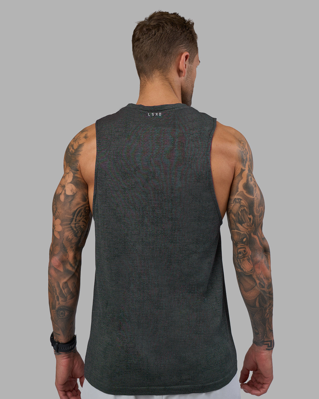 Man wearing AeroFLX+ Seamless Muscle Tank - Black Camo-Graphite | Model:Tommy | Size:S - view 6