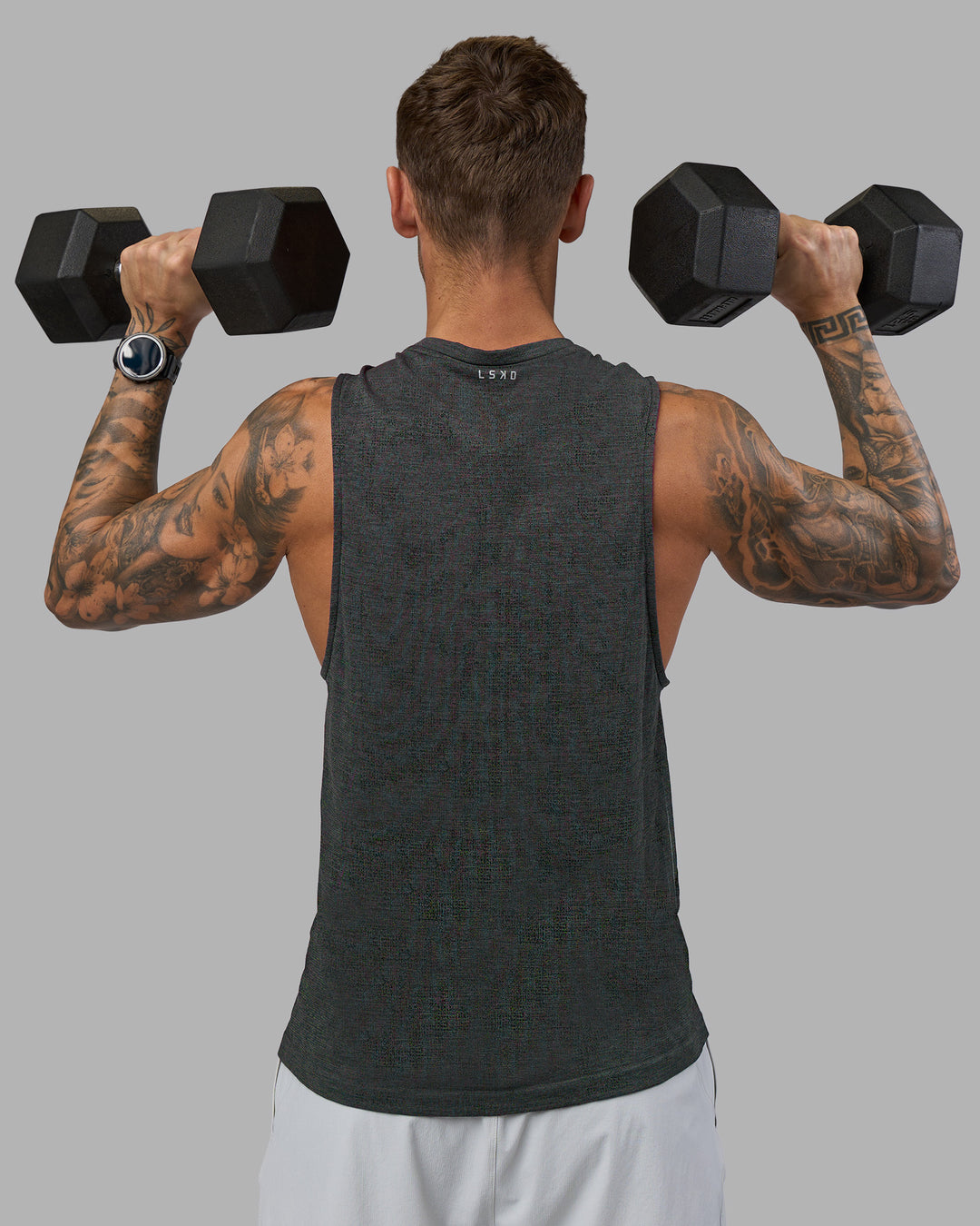 Man wearing AeroFLX+ Seamless Muscle Tank - Black Camo-Graphite | Model:Tommy | Size:S - view 3