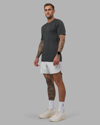 Man wearing AeroFLX+ Seamless Tee - Black Camo-Graphite | Model:Tommy | Size:L | Thumbnail Index: 1