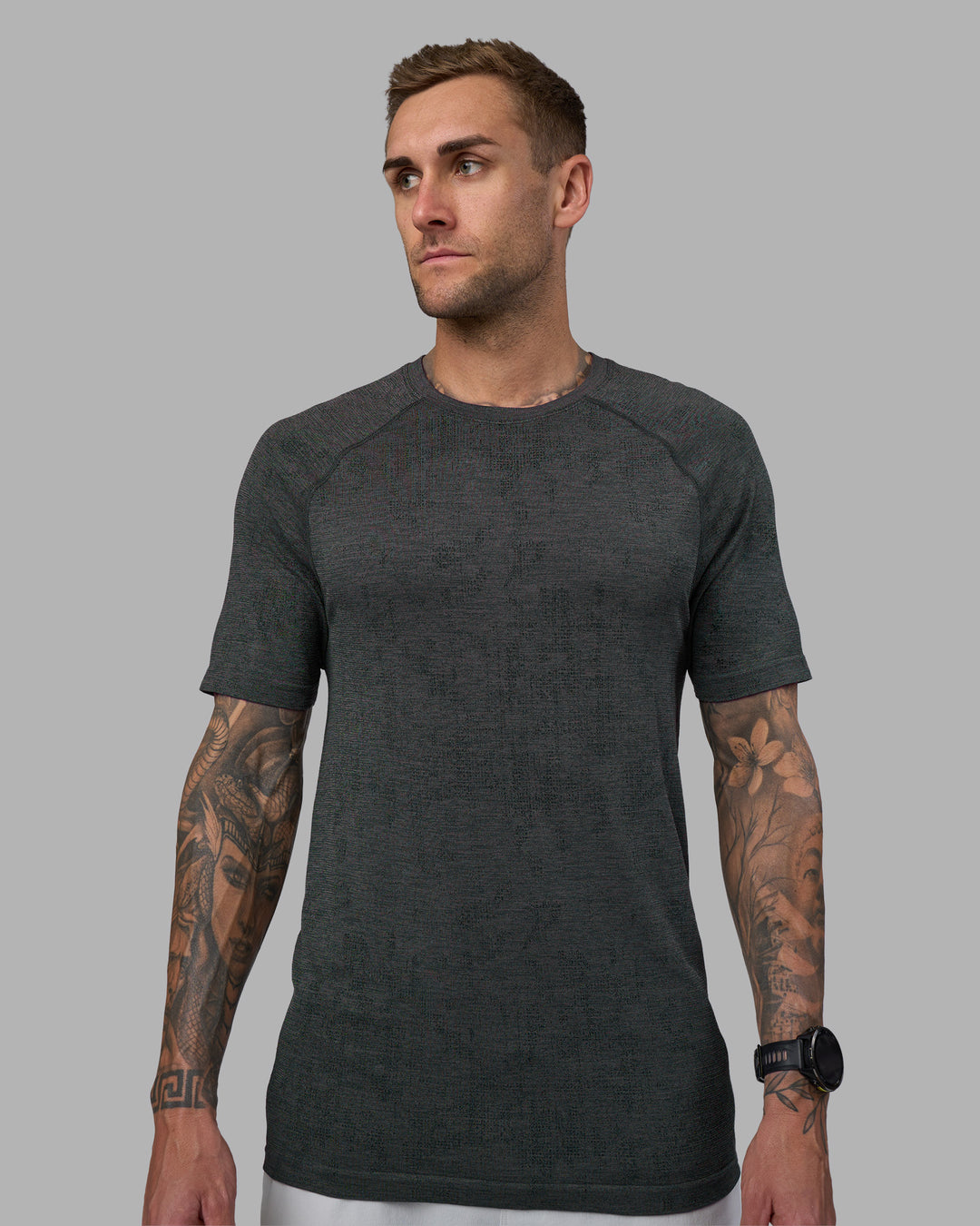 Man wearing AeroFLX+ Seamless Tee - Black Camo-Graphite | Model:Tommy | Size:L - view 1