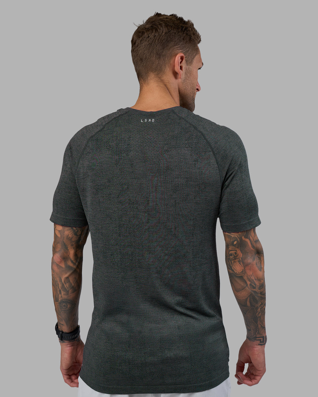Man wearing AeroFLX+ Seamless Tee - Black Camo-Graphite | Model:Tommy | Size:L - view 4