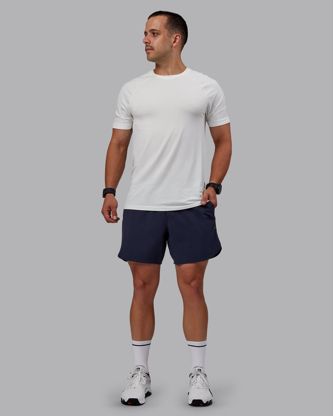 Man wearing AeroFLX+ Seamless Tee - Off White/Off White Marl - view 6