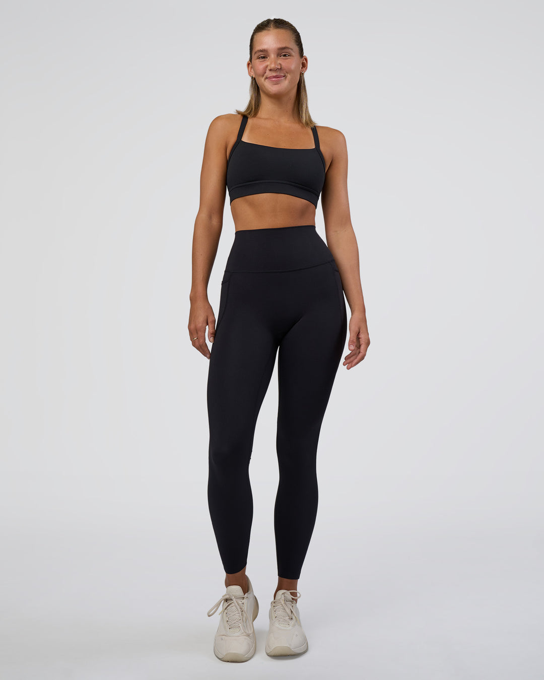 Woman wearing Momentum Sports Bra - Black | Model:Amity | Size:S - view 3