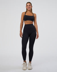 Woman wearing Momentum Sports Bra - Black | Model:Amity | Size:S | Thumbnail Index: 2