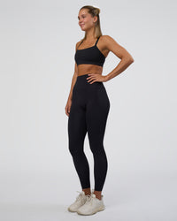 Woman wearing Momentum Sports Bra - Black | Model:Amity | Size:S | Thumbnail Index: 4