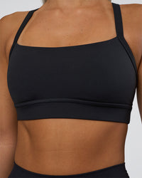 Woman wearing Momentum Sports Bra - Black | Model:Amity | Size:S | Thumbnail Index: 3