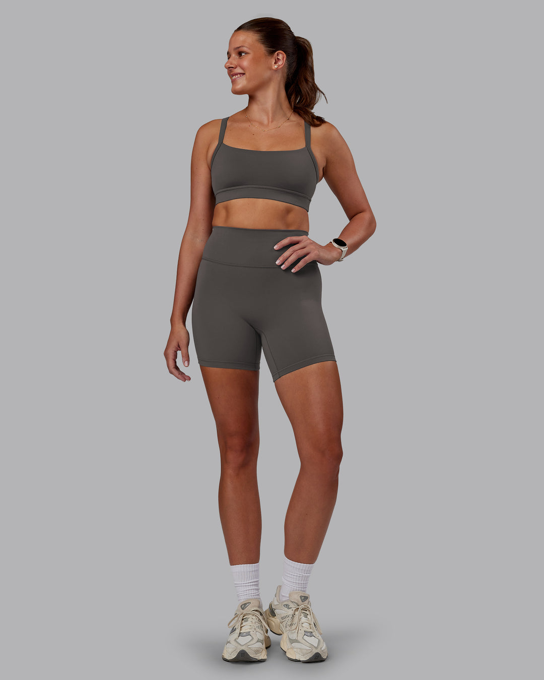 Woman wearing Momentum Sports Bra - Dark Storm | Model:Phoebe | Size:S - view 5