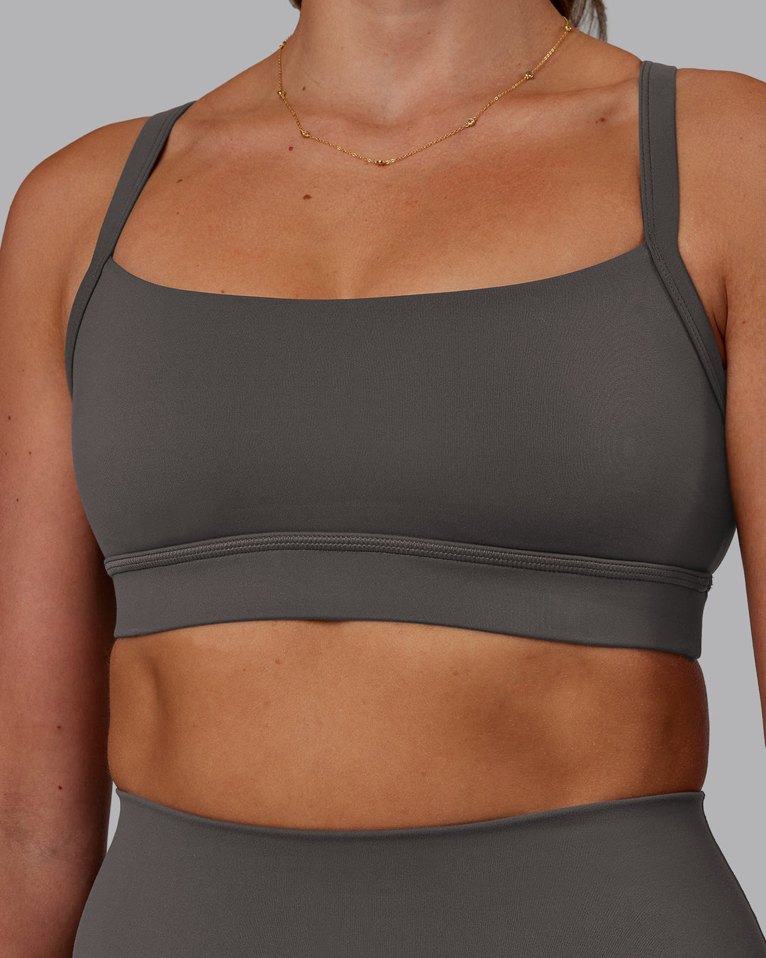 Woman wearing Momentum Sports Bra - Dark Storm | Model:Phoebe | Size:S - view 4
