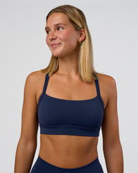Woman wearing Momentum Sports Bra - Future Navy | Model:Amity | Size:S | Thumbnail Index: 0